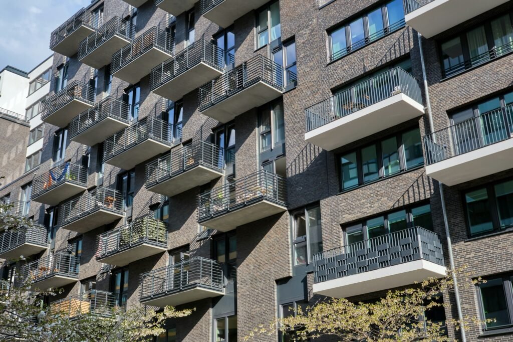 Modern gray apartment building with many balconies